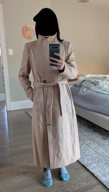 Closed coat, belted, with suit jacket underneath