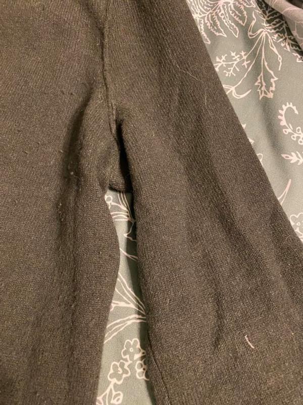 Not even tried on. Fibers, pet hair, and pills