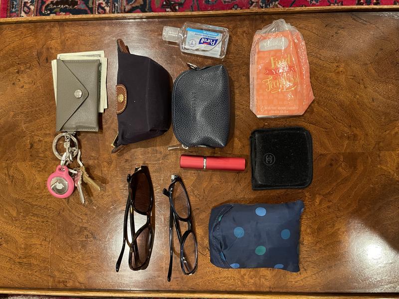 Strap is adjustable and super comfortable. Great quality bag.