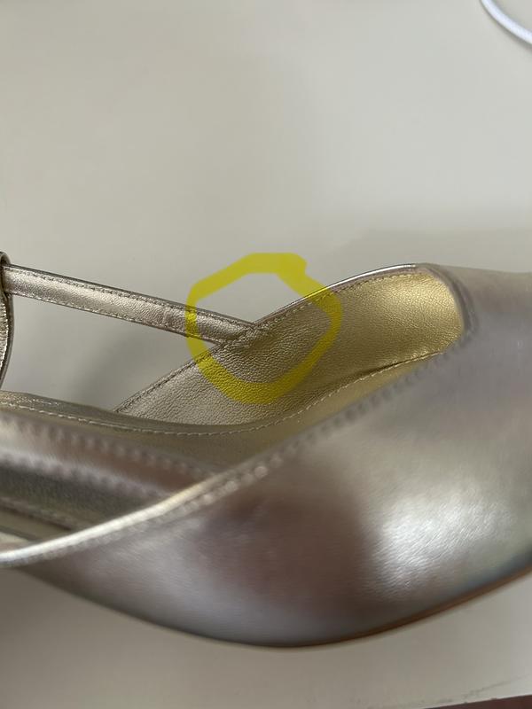 Shoe rubs where the strap is sewn to the main part of the shoe.