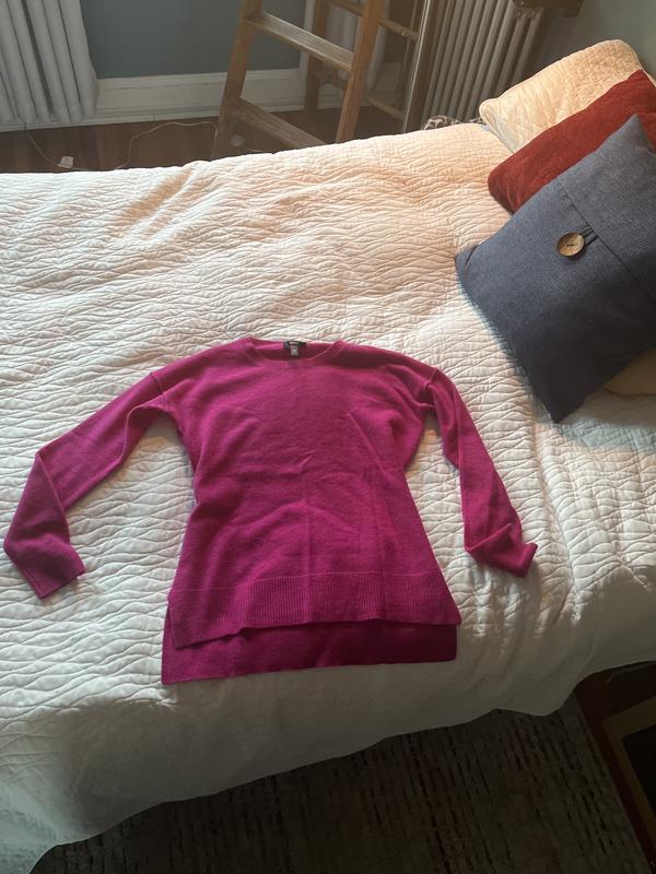 Off hanger flat on bed.