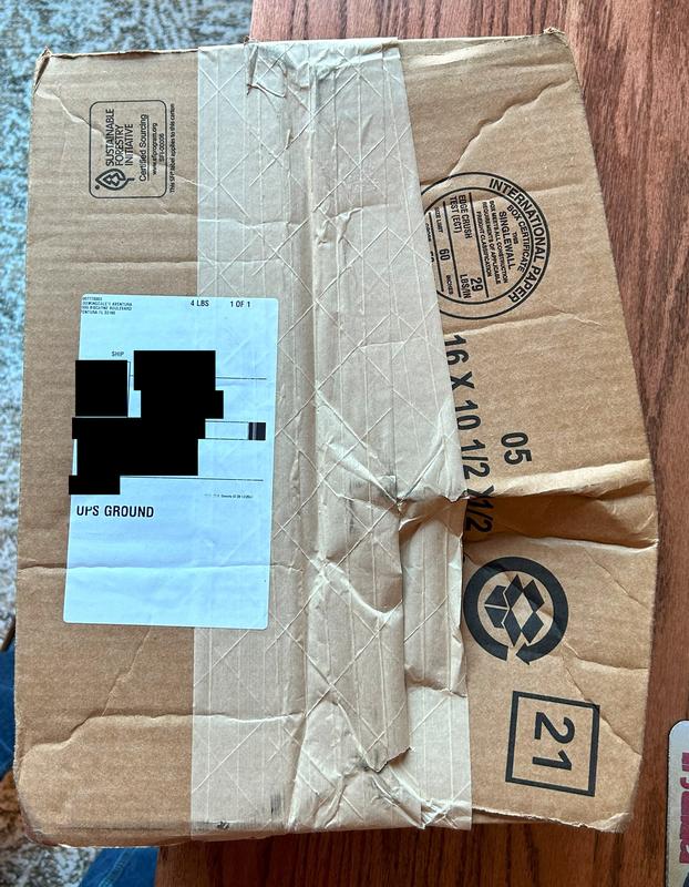 Box purposely packaged in a bulging fashion to try to accommodate the item that was too big for the box it was shipped in.