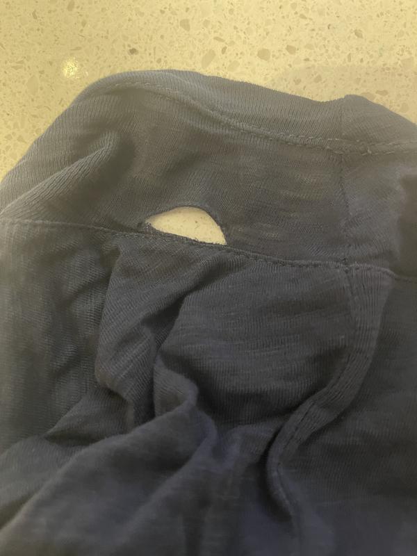 Hole under armpit after light wear