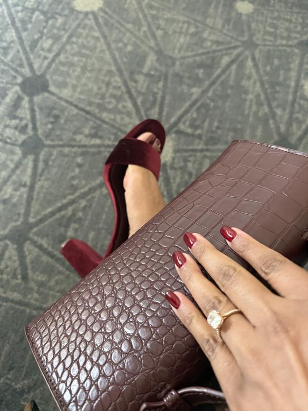 The purse with burgundy heels