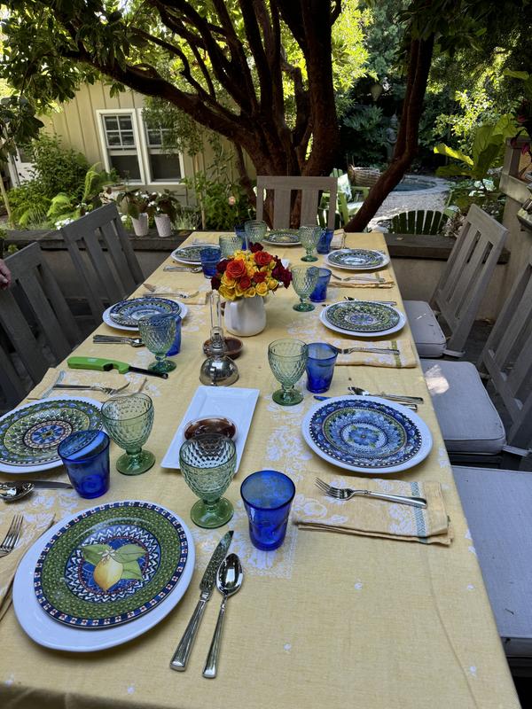 Outdoor garden picnic with green goblets.