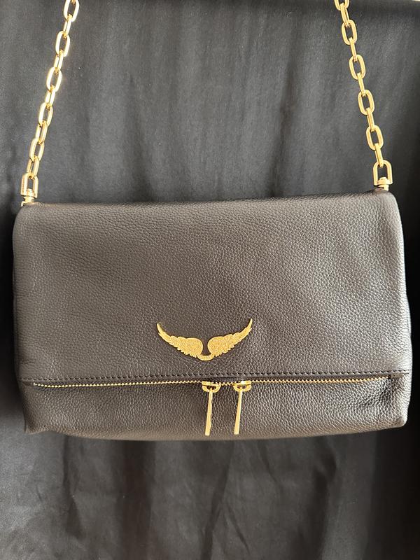 Rocky Chance in black leather with gold hardware