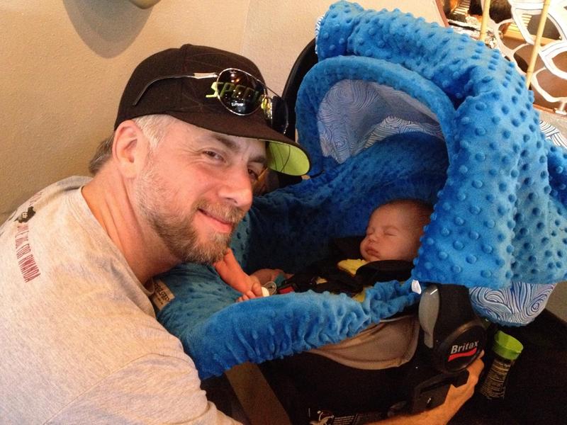 A Happy Parent with their son in the Britax B safe carseat