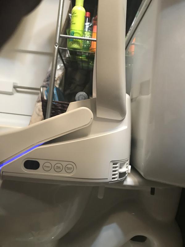 As you can see this is as far back as the toilet seat and go