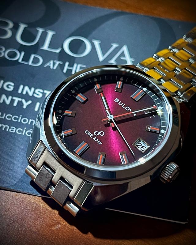 Bulova red face top watch