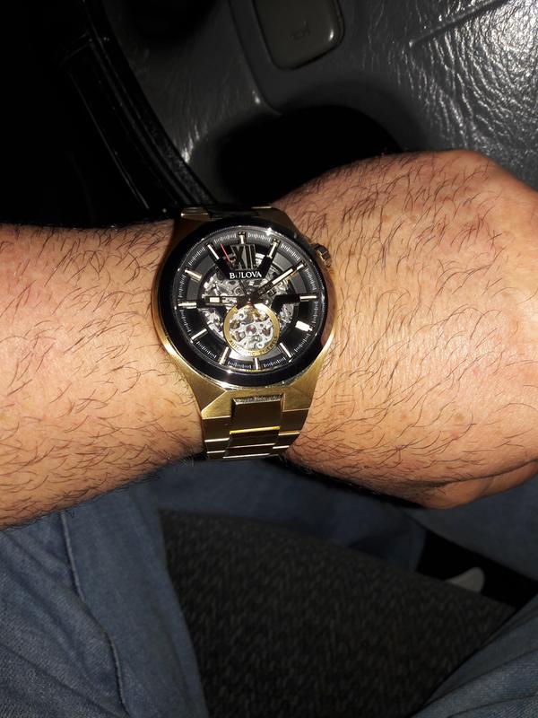 Bulova black and outlet gold watch