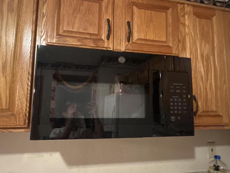 GE 1.6 cu. ft. Over the Range Microwave in Bisque