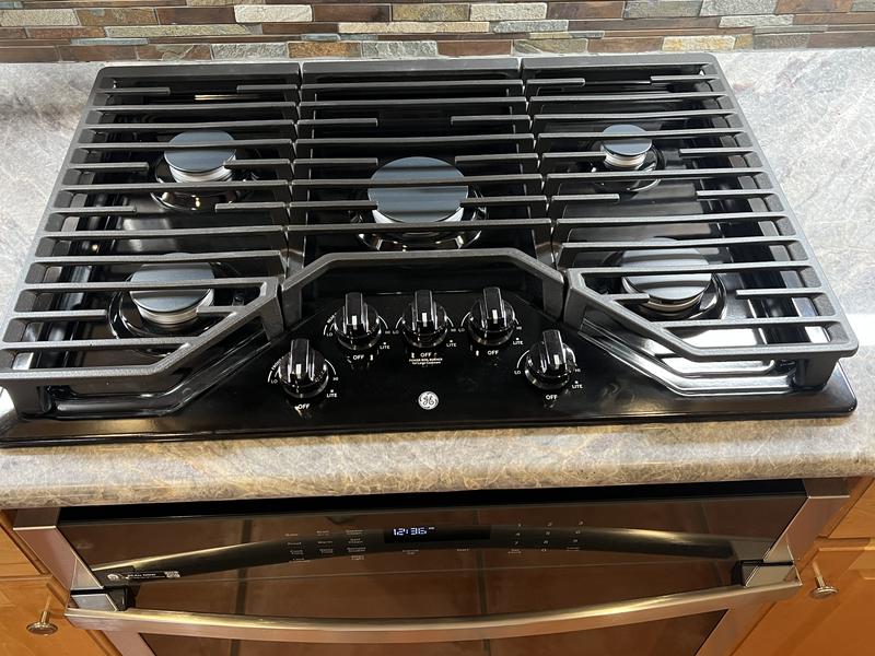PGP7030DLBB in Black by GE Appliances in Bangor, ME - GE Profile™ 30  Built-In Gas Cooktop with 5 Burners and Optional Extra-Large Cast Iron  Griddle