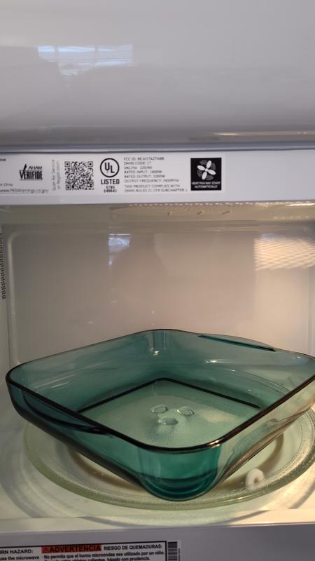 GE 1.6 cu. ft. Over the Range Microwave in Bisque