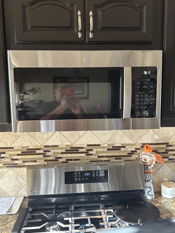 GE 1.6 cu. ft. Over the Range Microwave in Bisque