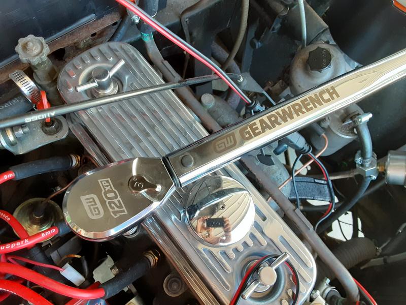 Checking head bolt torque.