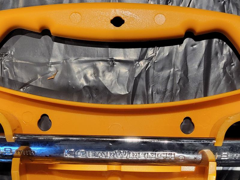 Close-up of wrench set holder hanging holes