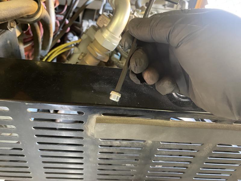 Magnet holding plug for governor