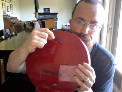 See the broken piece in my hand from the lid that secures the two plates together