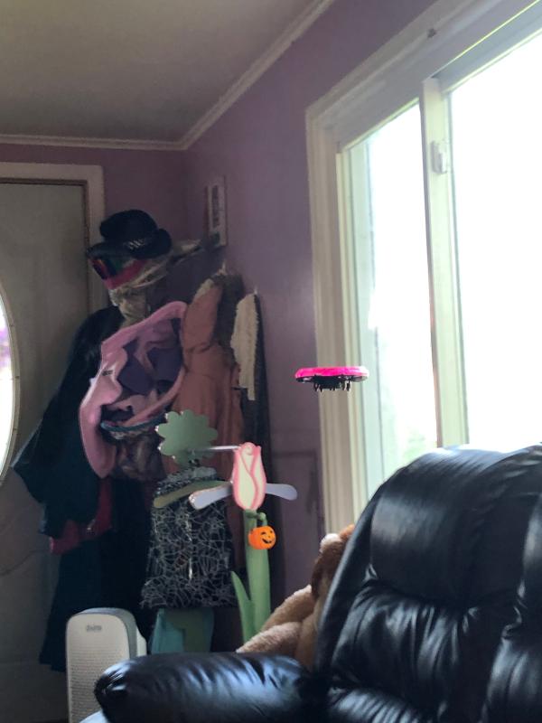 The drone hovering over the couch