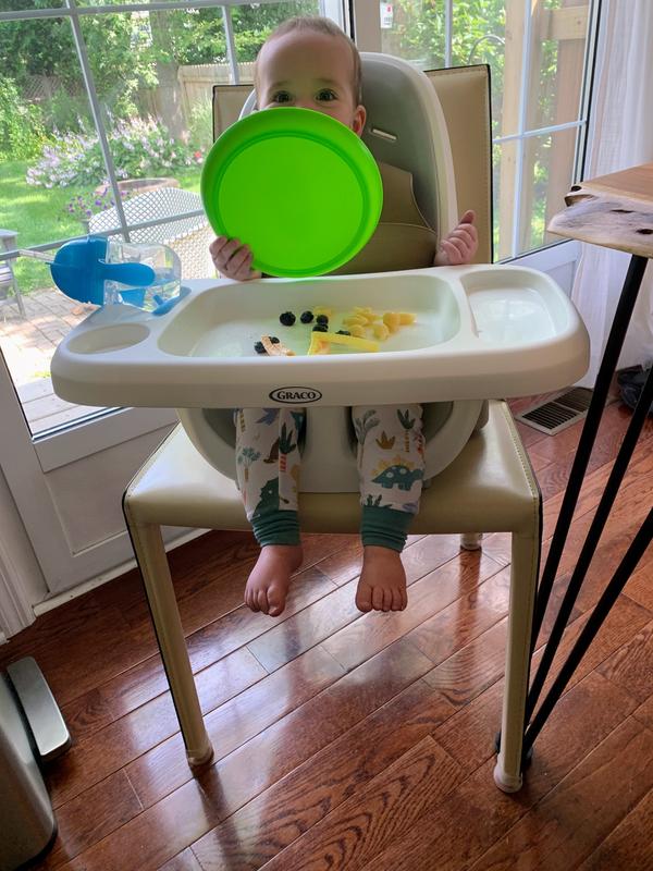 High chair 2024 hangs on table