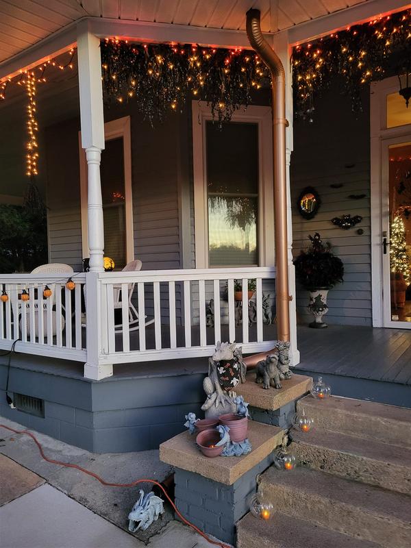 Customer porch styled with multiple pre-lit Halloween garlands