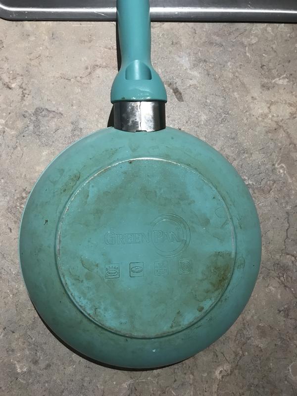 Bottom of pan. I’ve scrubbed but can’t get it clean. Use gas stove