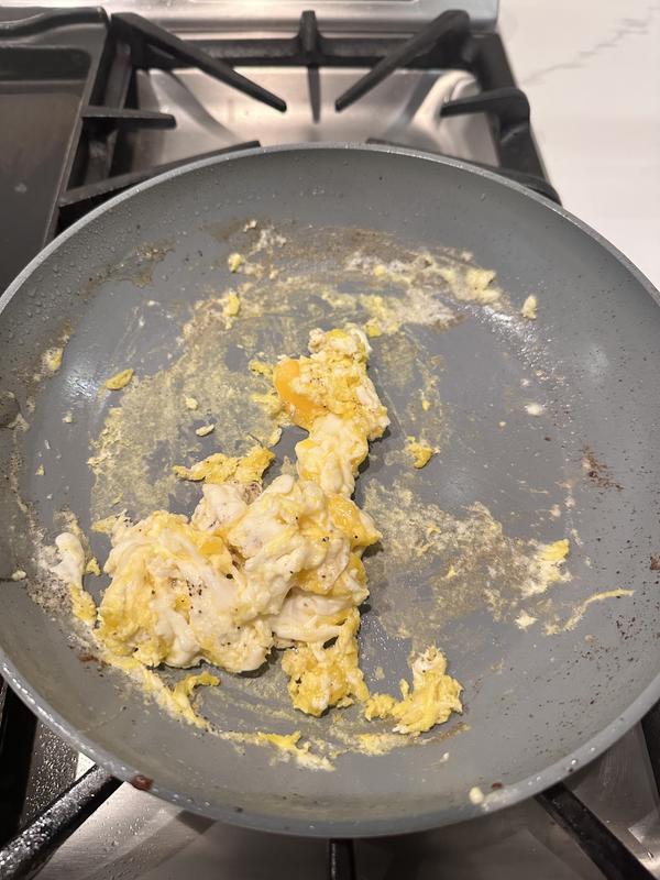 Used oil and eggs still stuck to pan