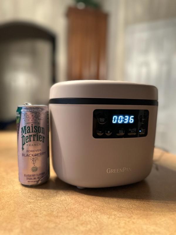Customer photo for "Compact, stylish rice cooker that cooks up to 8 cups perfectly, is easy to use, and delivers great results even with my little user error!"