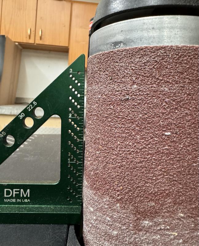 Front shelf does not raise high enough to square with the belt sander.