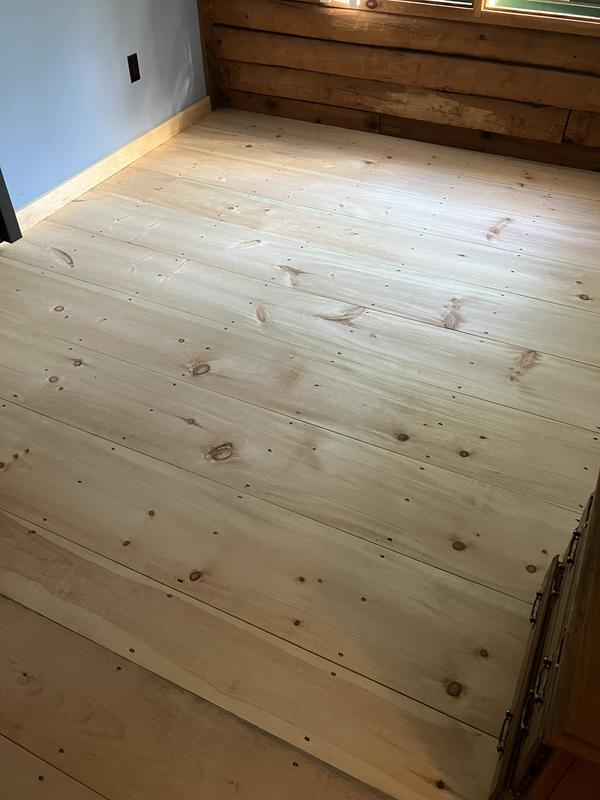 12” pine boards cut with my Woodmizer LT 15 being nailed down with square nails.