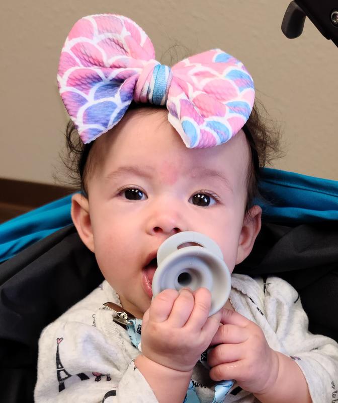 Popping in her pacifier