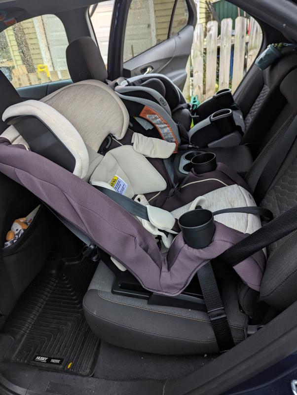 View of seat installation, rear facing with seatbelt| Another view of the car seat| View of opposite side with a second car seat installed