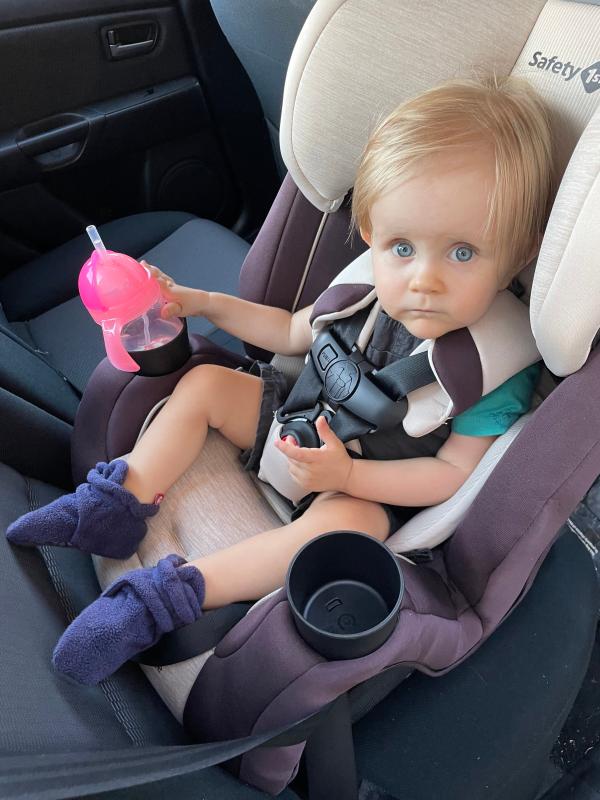Happy kiddo in his new car seat!| Easy installation| He loves having the cup holders!| He wanted to try it out right away!