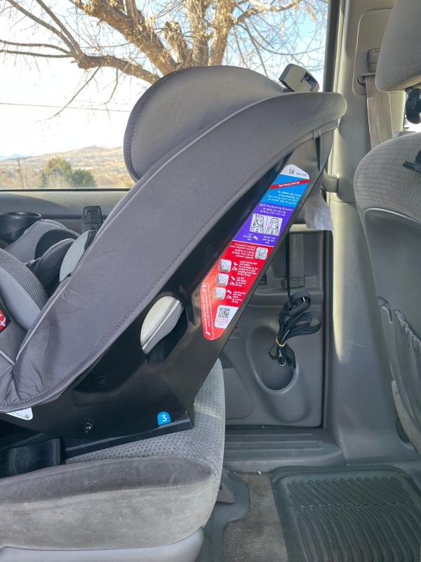 Love how the harness is held out of place! And check out that buckle cushion!| Just a sticker to see if it's properly leveled. Is it?| He loves it.