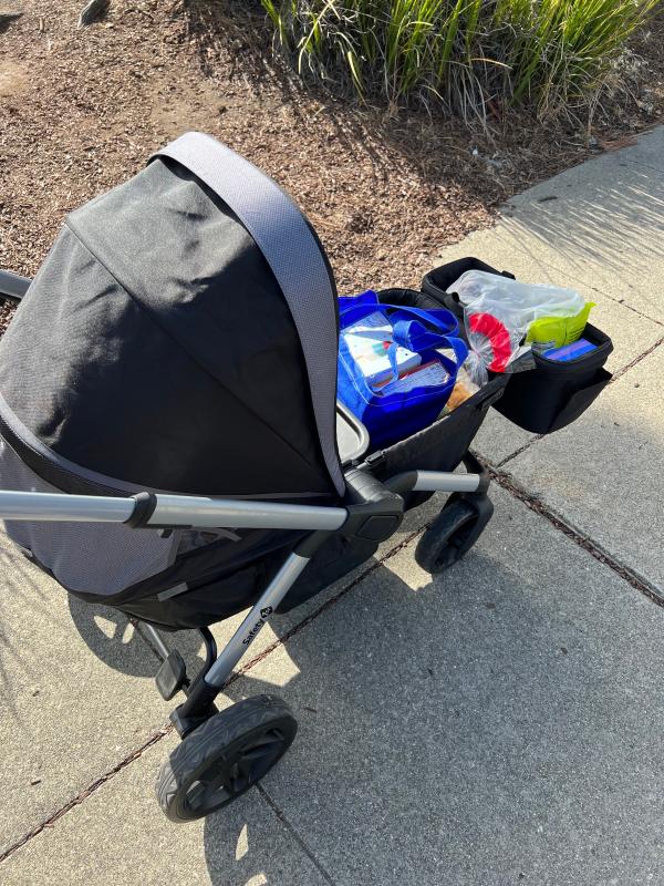 Adjustable handles so my tall husband can comfortably push it| 2 happy kiddos headed to the park| Fits grocery bags with ease along with one kiddo!