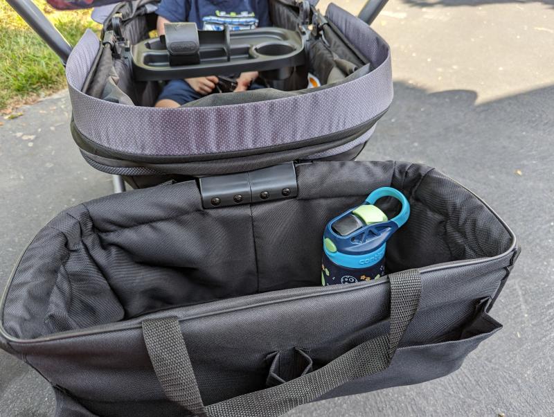 Lots of foot room with zip out well for cleaning| Side pocket holds small child cup but not adult waterbottle| Sufficient spf50 sun coverage| Plenty of head room for my three year old| We are big fans!| Spacious storage basket