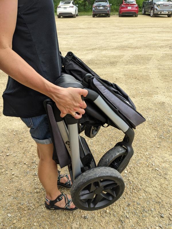 Testing out the uphill capabilities.| Folds easy and compact.| Box description- Footwell "zips out for easy cleaning or for optimal storage." No instructions in the manual.| Wheels for all-terrian.| Nature park outing.| Caught in the rain-towel covering the gap.| Still dry!| Splash pad with my 5 & 3 year olds.| Loaded up for the pool!| Caught in the rain- notice the gap between the canopies.| Pushing the girls at a nature park.