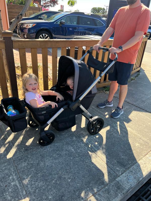 Adjustable handles so my tall husband can comfortably push it| 2 happy kiddos headed to the park| Fits grocery bags with ease along with one kiddo!