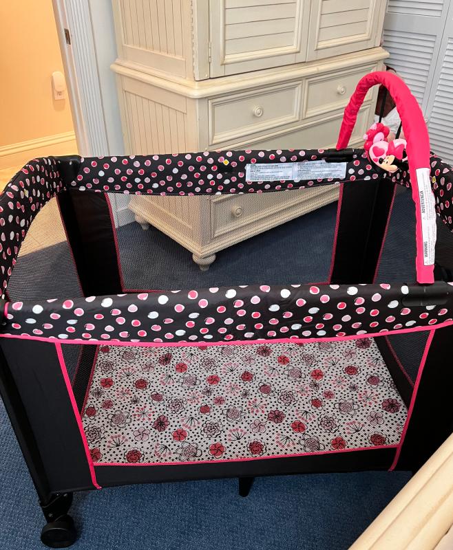 Adorable Minnie Mouse details| Exterior of Play Yard with super cute print and breathable sides| Colorful easy to wipe-down mattress that can be used with or without a sheet.