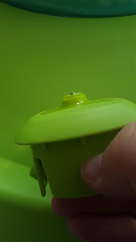 Up close of removable piece with metal exposed screw