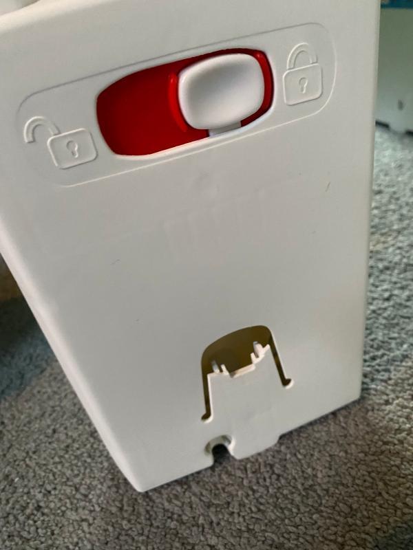 broken tab that locks leg into base