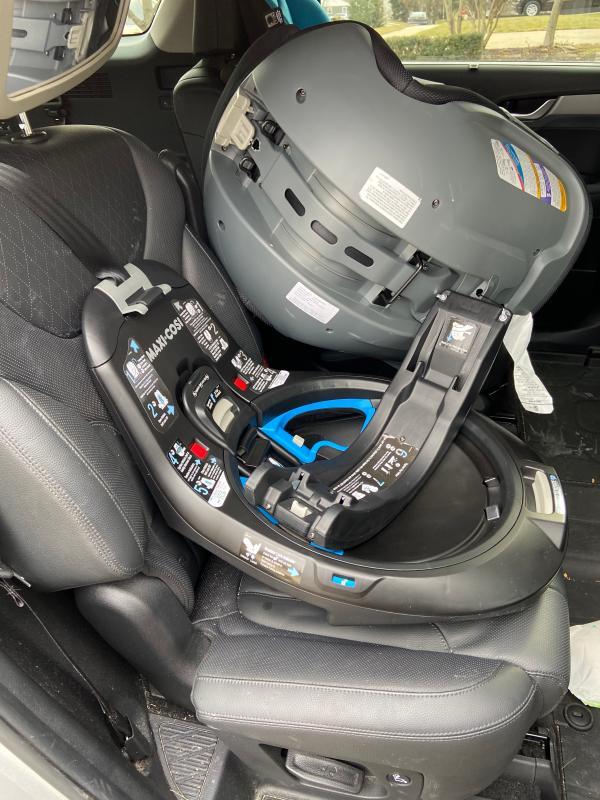 The buckle holders to keep the straps out of your way - a great feature!| Flipping the whole seat over during installation - awkward and requires a lot of space.