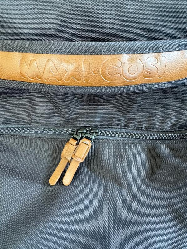 360* wheels that glide like butter| Backpack straps with padding| One of many handles| Double zipper with gorgeous tabs