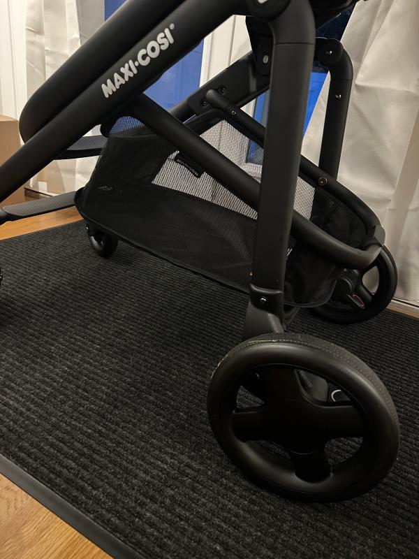 Stands by itself when folded!| Lever to adjust stroller seat recline| Bassinet setting when stroller seat is fully reclined| Included rain shield| Love the 360 degree canopy!| Straps need to be pulled together before being inserted into bottom buckle| Stroller with car seat| Small basket