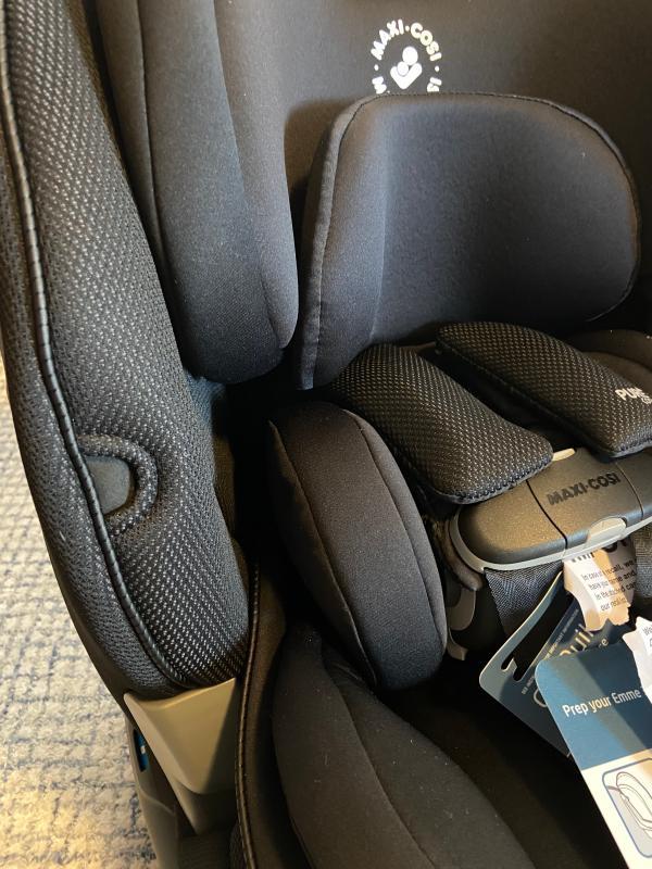 The buckle holders to keep the straps out of your way - a great feature!| Flipping the whole seat over during installation - awkward and requires a lot of space.