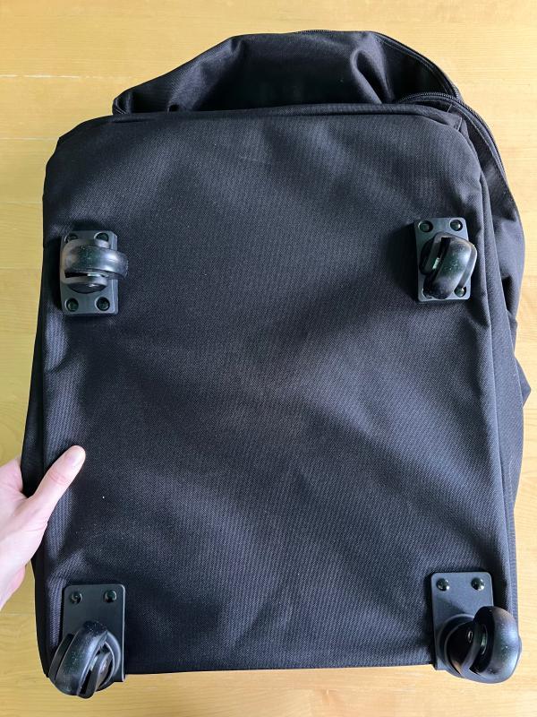 Pockets for the backpack straps| The wheels and platform base