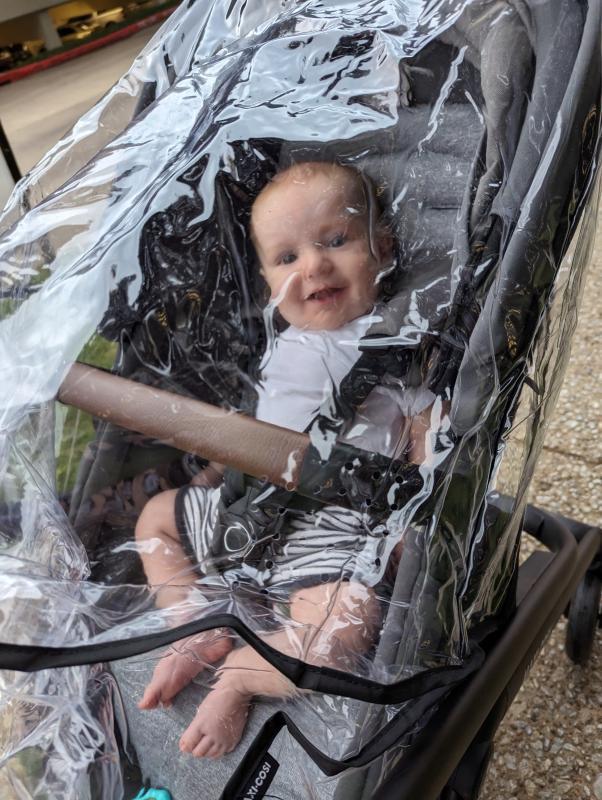 Safe and dry under my rain cover!| Toddler checking on baby in bassinet