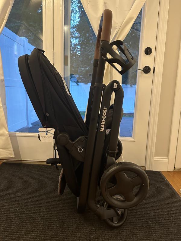 Stands by itself when folded!| Lever to adjust stroller seat recline| Bassinet setting when stroller seat is fully reclined| Included rain shield| Love the 360 degree canopy!| Straps need to be pulled together before being inserted into bottom buckle| Stroller with car seat| Small basket