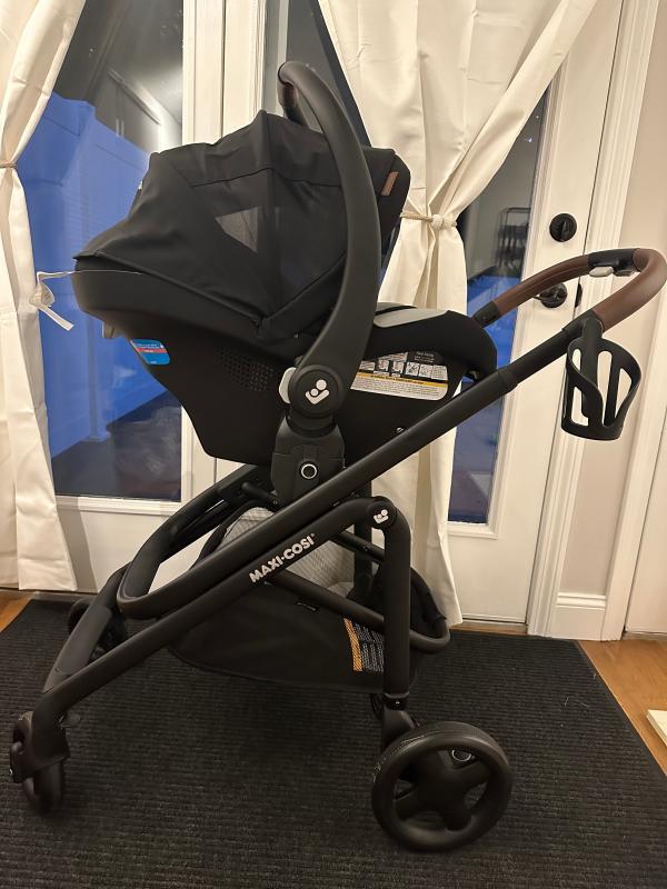 Stands by itself when folded!| Lever to adjust stroller seat recline| Bassinet setting when stroller seat is fully reclined| Included rain shield| Love the 360 degree canopy!| Straps need to be pulled together before being inserted into bottom buckle| Stroller with car seat| Small basket