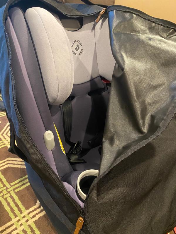 shoulder straps - 1 folded in and 1 out| bag with zipper half open